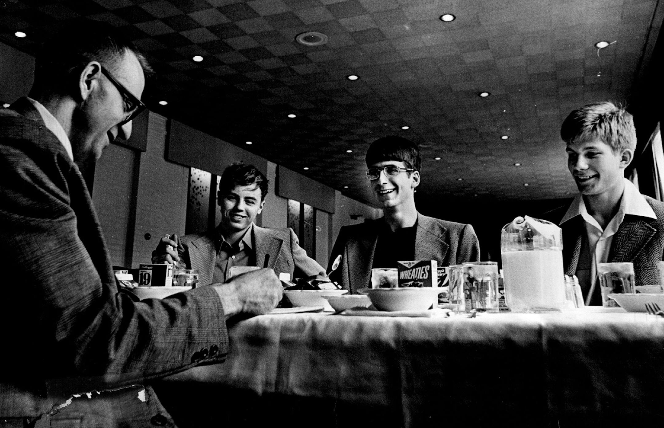 Enjoying breakfast the morning after winning the 1973 class A high school basketball championship were, from left, Chisholm coach Bob McDonald and players Louis Janezich ,Mike Kochevar and Tim Casey.