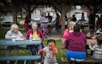 Neighbors from the Micronesian community and the mostly Scandinavian community of Milan, Minn., gathered for their monthly community potluck at the to