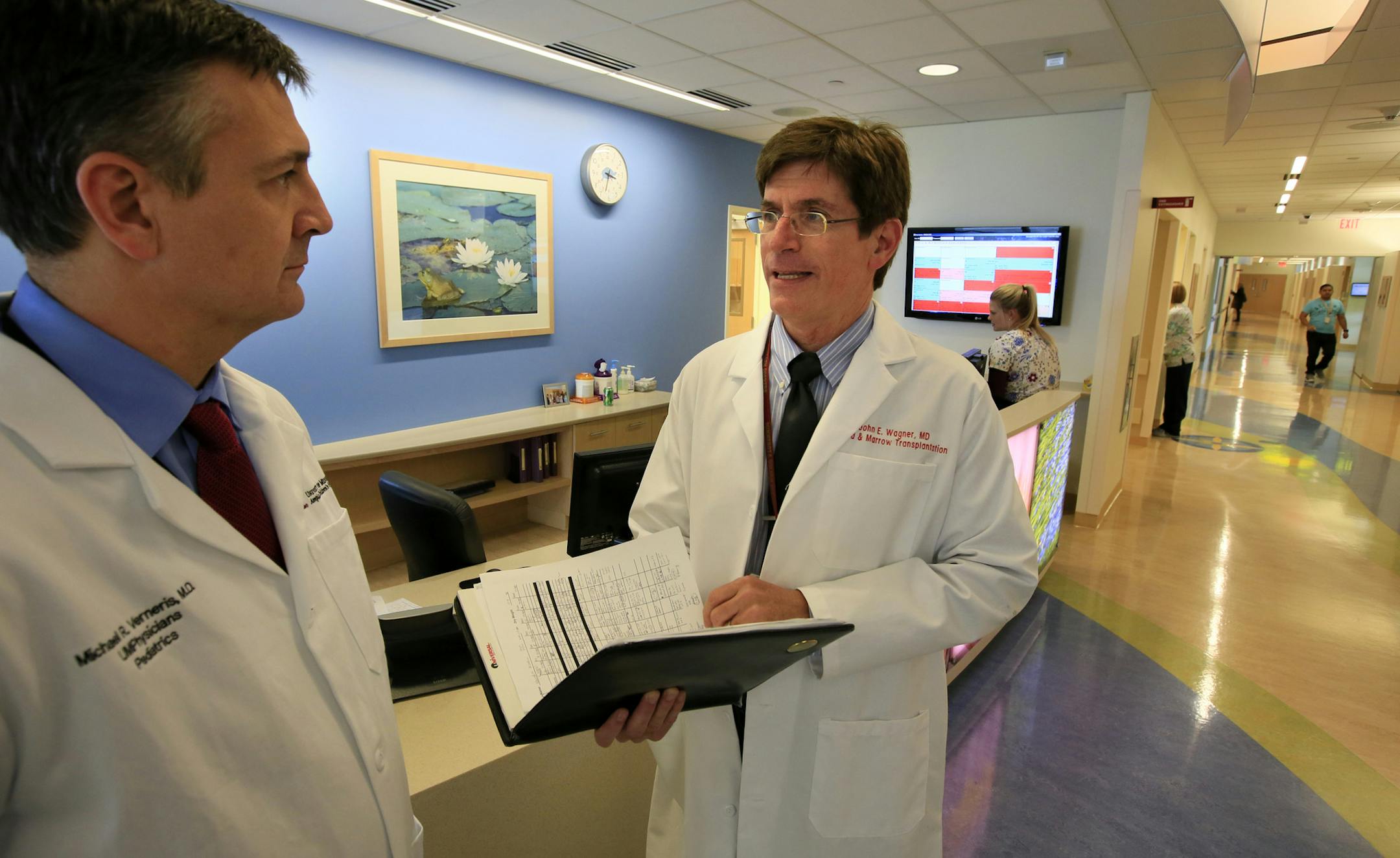 Dr. Michael Verneris (left) and Dr. John Wagner talk about the groundbreaking procedure they believe may cure a child of both AIDS and leukemia. It's a unique form of cord-blood transplant. Only one person on the planet has had anything like it before. And he's now free of HIV. ] BRIAN PETERSON ‚Ä¢ brianp@startribune.com Minneapolis, MN - 04/18/2013