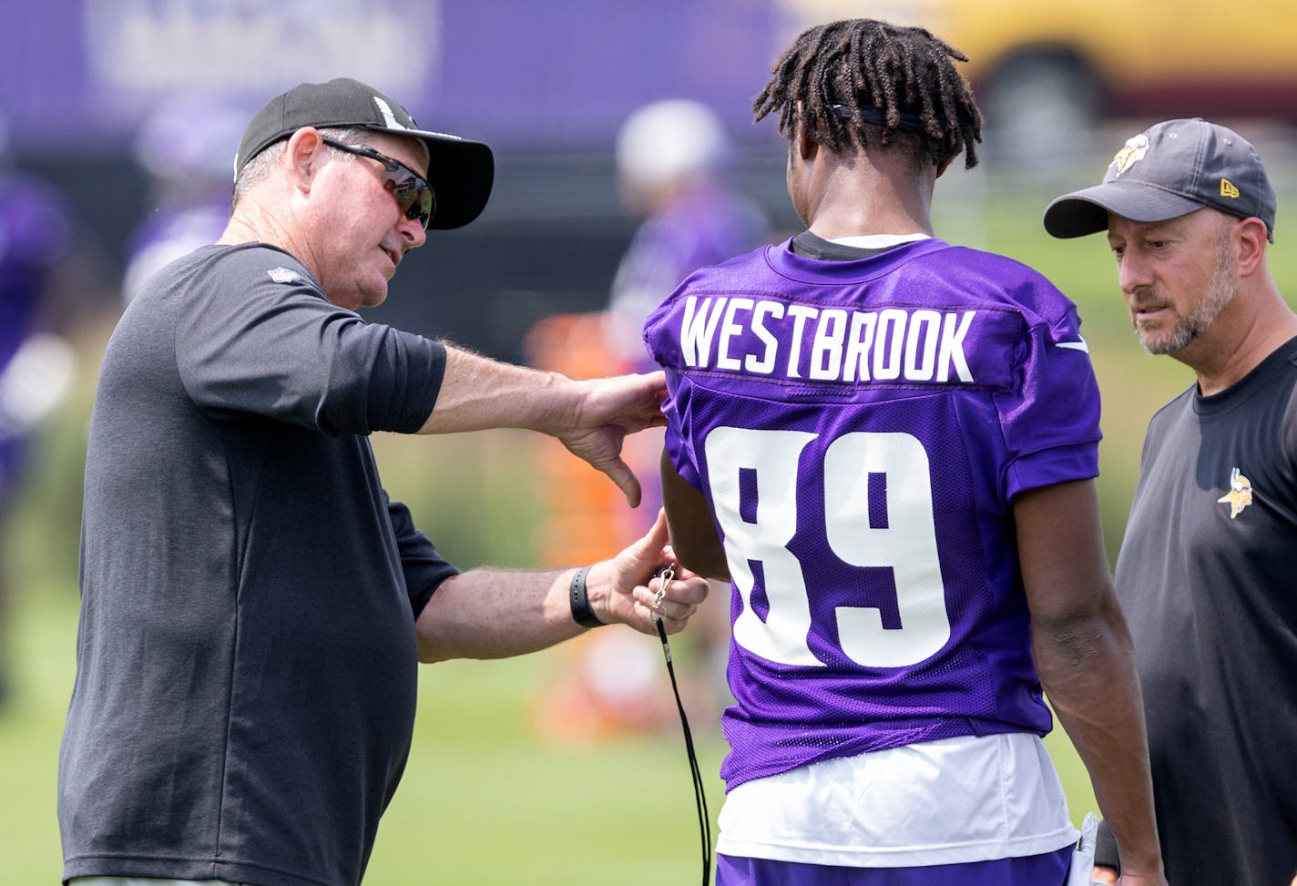 Minnesota Vikings head coach Mike Zimmer joked with receiver Dede Westbrook (89).