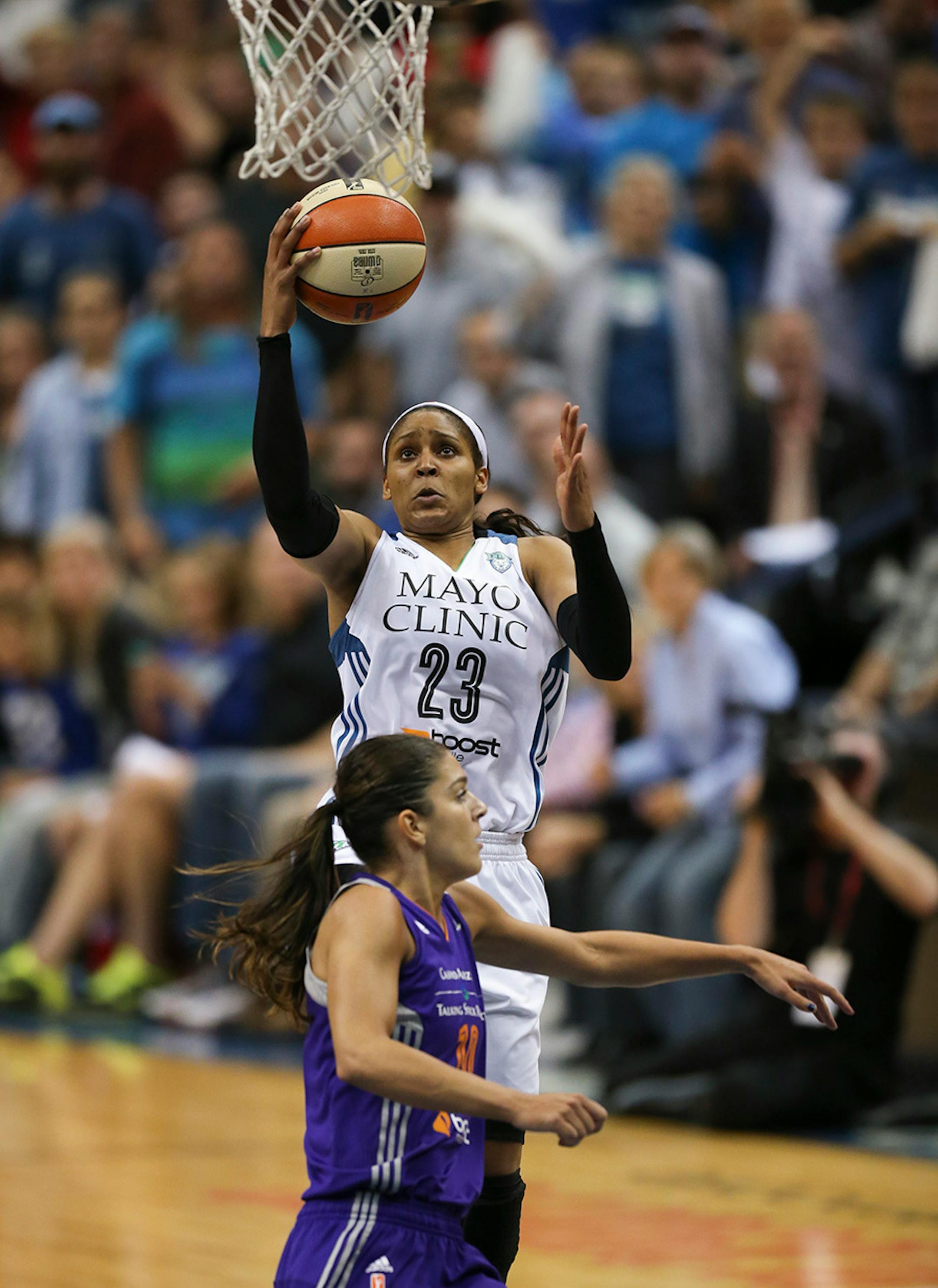 Lynx forward Maya Moore (23) with a late fourth quarter layup over Phoenix Mercury guard Marta Xargay Casademont (10) Thursday night at Target Center. She finished with 19 points.