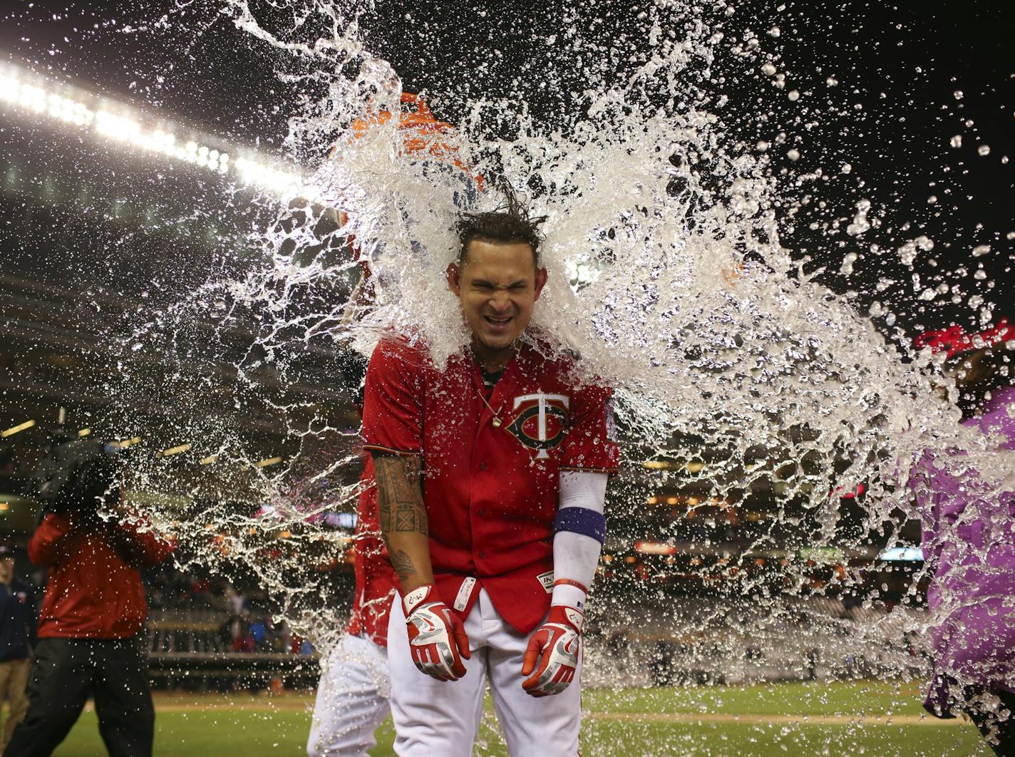 Twins' Oswaldo Arcia received a Gatorade shower just before he was going to do a post-game interview after his walk off home run gave the Twins a victory in April.