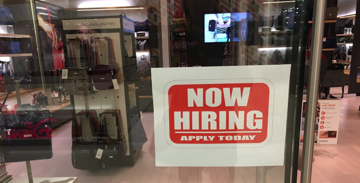 A sign in the store window at the Baggallini store at Mall of America with information on how to apply for holiday jobs. Oct. 9, 2018