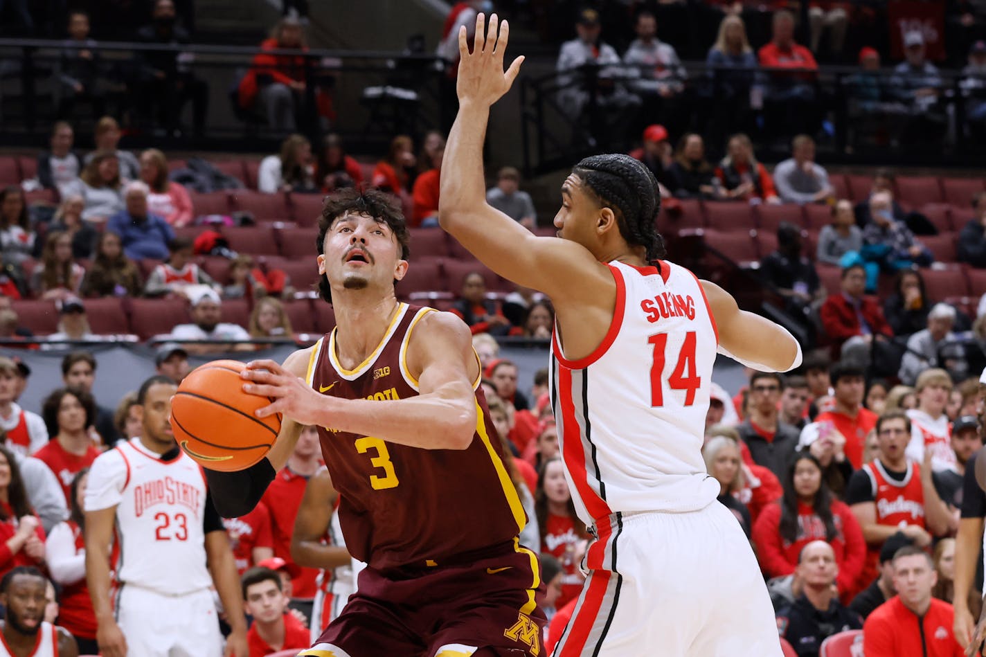 Minnesota's Dawson Garcia, left, looks for a shot against Ohio State's Justice Sueing during the first half of an NCAA college basketball game Thursday, Jan. 12, 2023, in Columbus, Ohio. (AP Photo/Jay LaPrete)