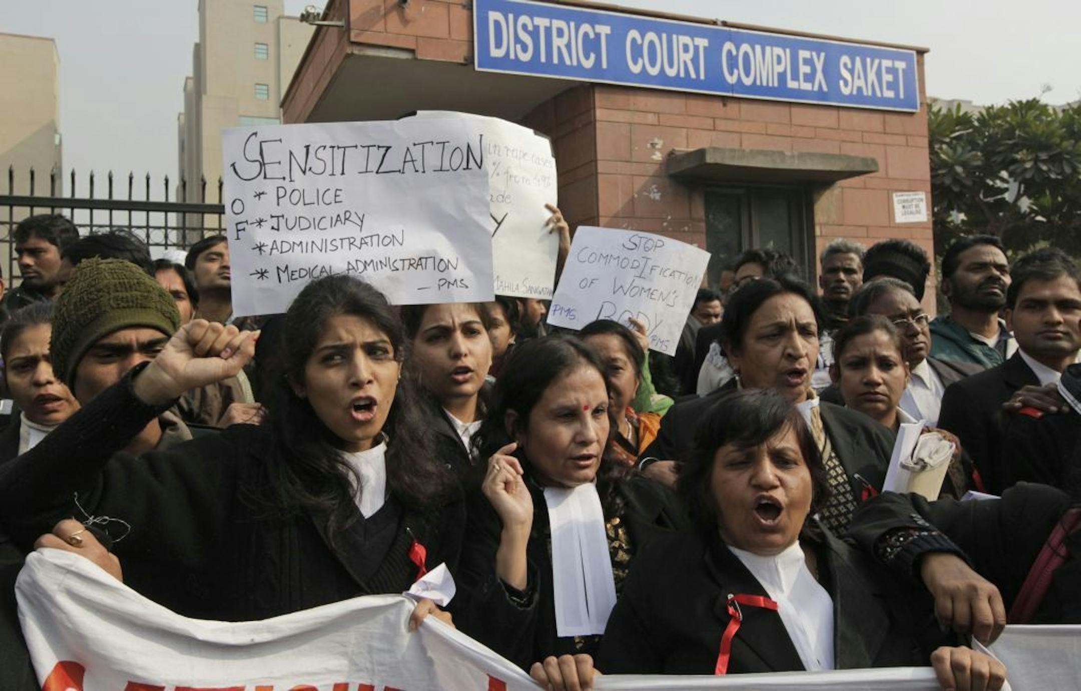 Indian women lawyers shout slogans against police and the government outside the District Court complex where a new fast-track court was inaugurated Wednesday to deal specifically with crimes against women, in New Delhi, India, Thursday, Jan. 3, 2013. Indian police were preparing Thursday to file rape and murder charges against a group of men accused of sexually assaulting a 23-year-old university student for hours on a moving bus in New Delhi. The Dec. 16 attack on the woman, who later died of