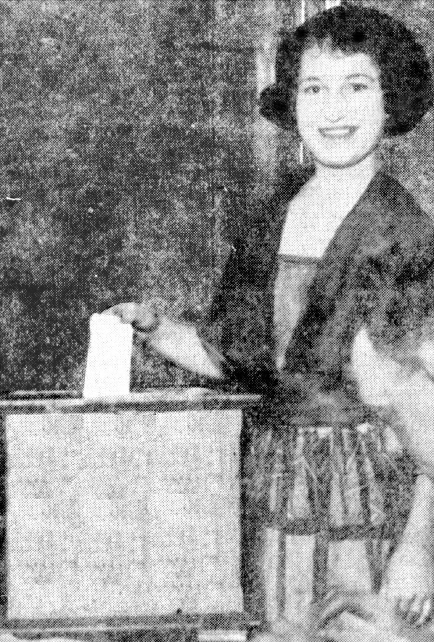 Woman casts a ballot