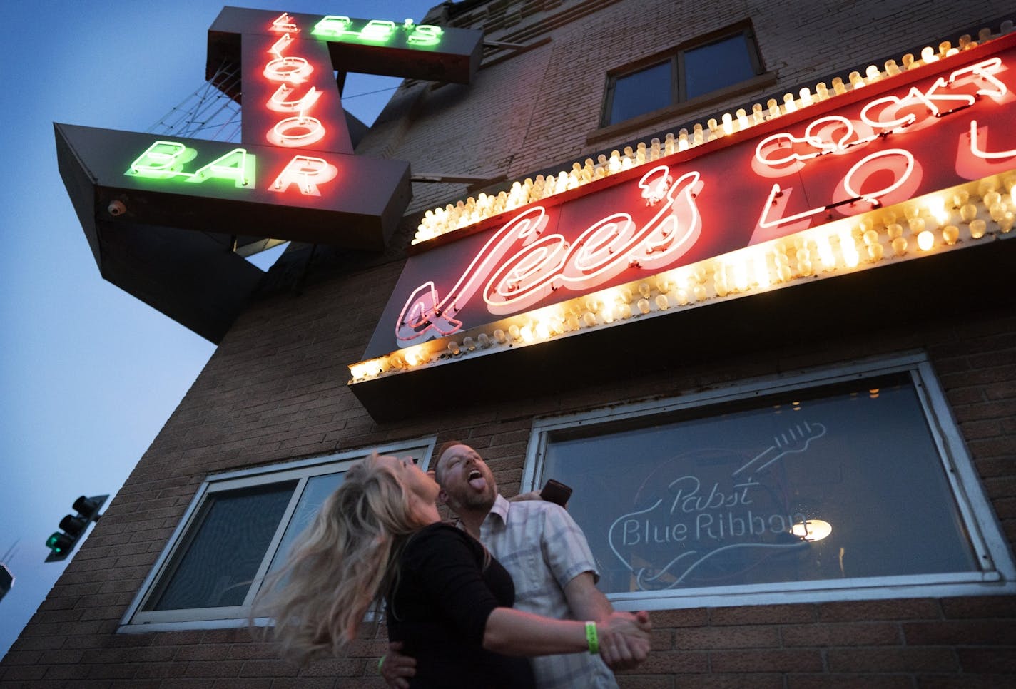 Joe and Shalee Palmquist of St. Paul had some fun under the Lee's Liquor Lounge on the the last of the club opening Tuesday May 14, 2019 in Minneapolis, MN.