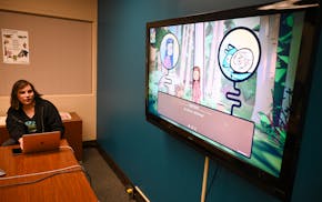 Co-director and lead developer Anang Hermes-Roach plays the first level of “Reclaim!” during a demonstration on April 29 at the University of Minn