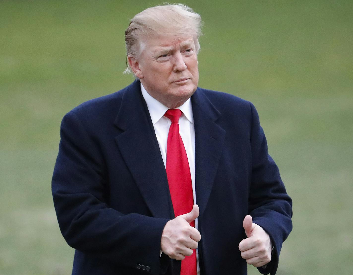 President Donald Trump give two thumbs up to guests after stepping off Marine One on the South Lawn of the White House, Sunday, March 24, 2019, in Washington. The Justice Department said Sunday that special counsel Robert Mueller's investigation did not find evidence that President Donald Trump's campaign "conspired or coordinated" with Russia to influence the 2016 presidential election. (AP Photo/Pablo Martinez Monsivais)