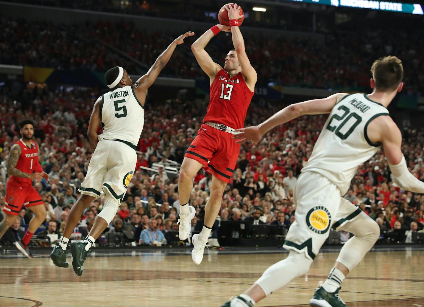 Texas Tech guard Matt Mooney (13) shot against Michigan State guard Cassius Winston (5) during the first half. ] CARLOS GONZALEZ &#xa5; carlos.gonzalez@startribune.com Texas Tech played Michigan State in a semifinal of the NCAA Division I Men's Basketball Championship Final Four on Saturday, April 6, 2019 at U.S. Bank Stadium in Minneapolis.