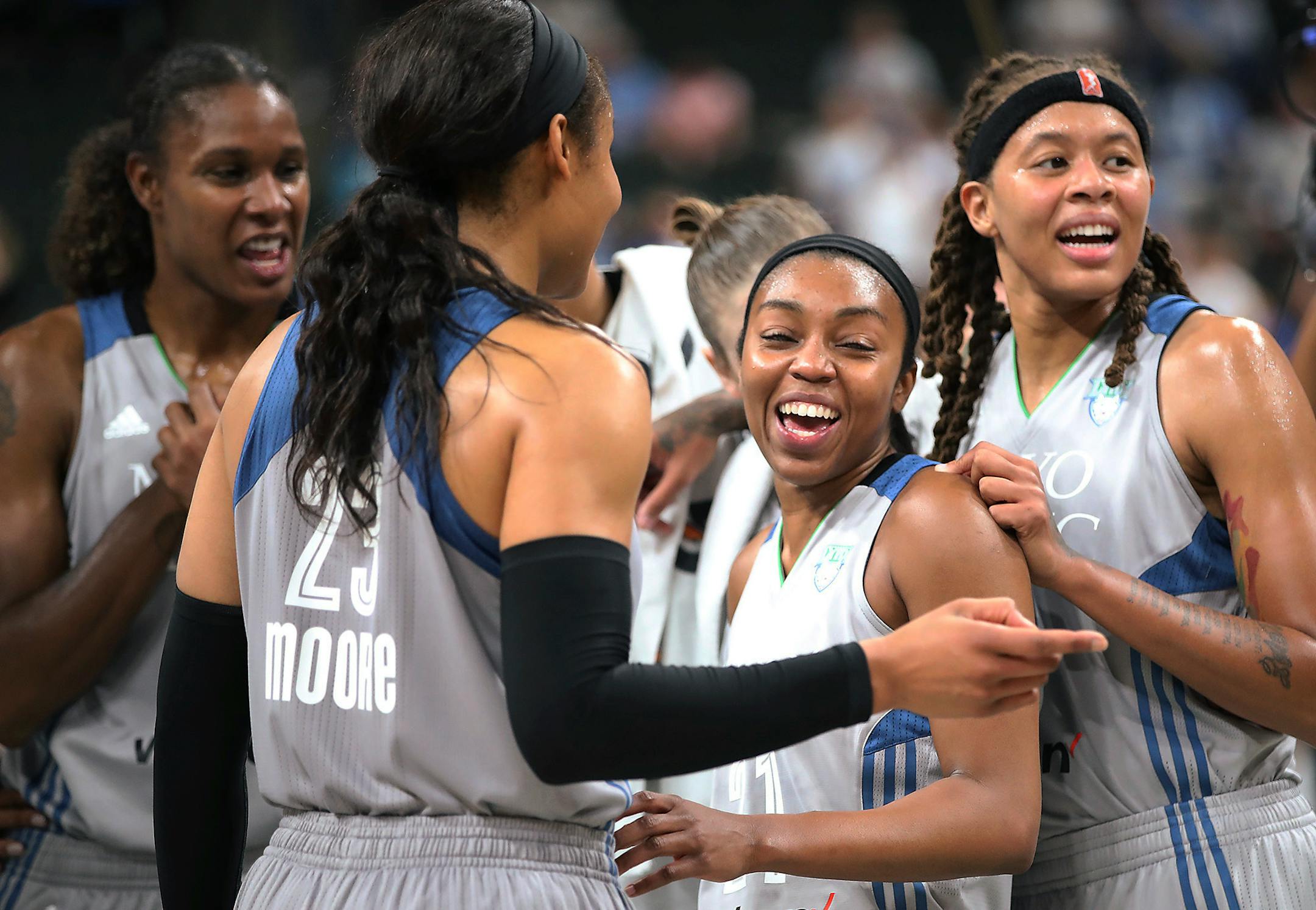 Minnesota Lynx players congratulate guard Renee Montgomery during the second half of the team's WNBA basketball game against the Los Angeles Sparks on Thursday, July 6, 2017, in St. Paul, Minn. (Elizabeth Flores/Star Tribune via AP)