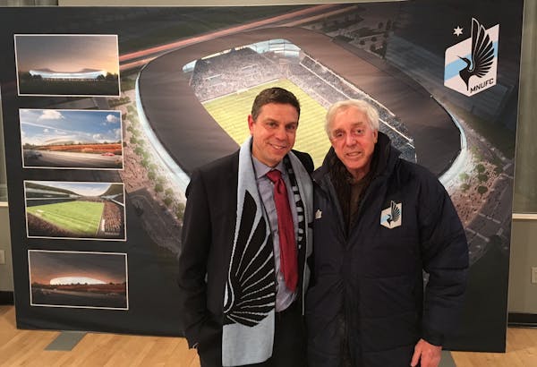 Photo for page 2 (if you need it). Minnesota United sporting director Manny Lagos and his father, Buzz, pose in front of images of United's new stadiu