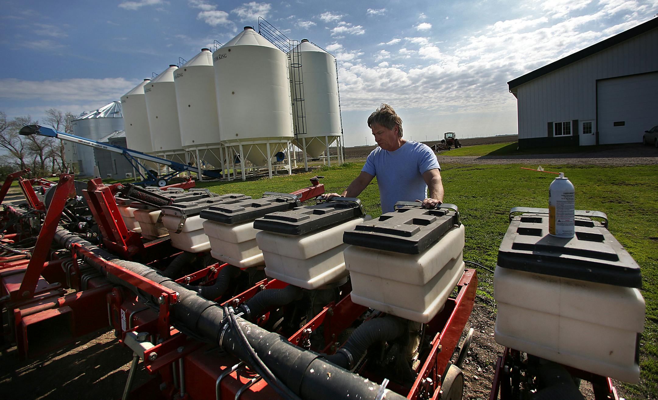 Organic farmer Mark Askegaard prepared equipment for planting soy beans as soon as his fields become dry enough to work. ] JIM GEHRZ &#x201a;&#xc4;&#xa2; jgehrz@startribune.com / Moorhead, MN / May 23, 2014 / 10:00 AM / BACKGROUND INFORMATION: Four generations of Mark Askegaard's family have farmed the land south of Moorhead, near Comstock. Now the land, and Askegaard's livelihood as an organic farmer, could be under threat. The massive $2 billion Red River diversion project is supposed to prote