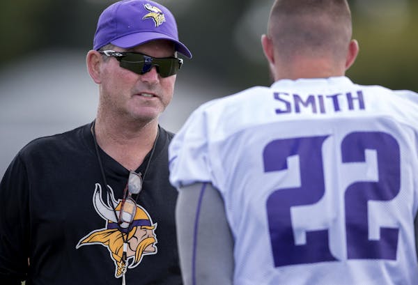 Minnesota Vikings head coach Mike Zimmer speaks with Harrison Smith during the afternoon practice session on Thursday, July 27, 2017, in Mankato, Minn