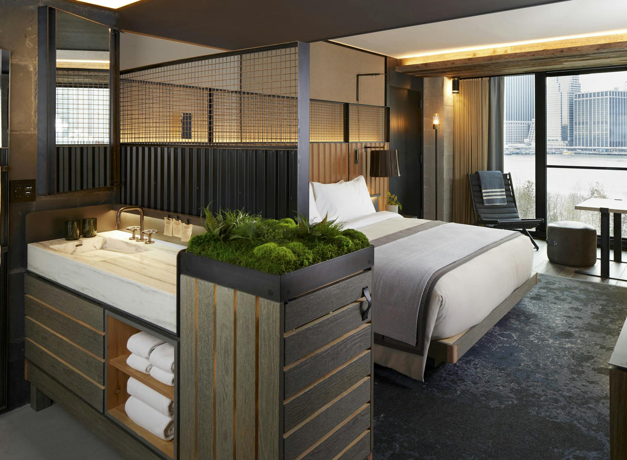 A typical room at the 1 Hotel is compact, while offering space for tons of storage and greenery. (MUST CREDIT: 1 Hotel Brooklyn Bridge) ORG XMIT: 547173347