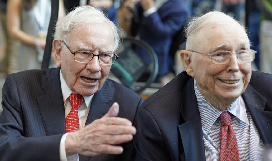Berkshire Hathaway Chairman and CEO Warren Buffett, left, and Vice Chairman Charlie Munger, briefly chat with reporters Friday, May 3, 2019, one day before Berkshire Hathaway's annual shareholders meeting. An estimated 40,000 people are expected in town for the event, where Buffett and Munger preside over the meeting and spend hours answering questions. (AP Photo/Nati Harnik) ORG XMIT: NENH1
