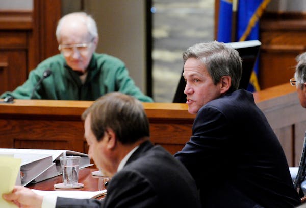 Republican Norm Coleman, right, listened to the testimony of Gerald Anderson, far left. At the end of the day, Coleman said of the witnesses: "You saw