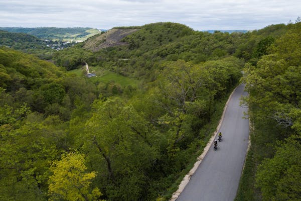Riders climb the bluffs towering above the Mississippi River near Winona Minnesota.
