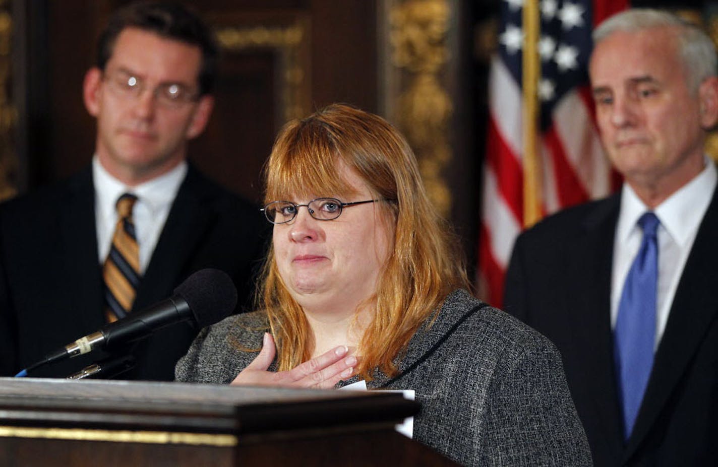 Anti-bullying advocate Tammy Aaberg shed tears as she recounted how her gay son, Justin committed suicide after being bullied. Behind her are Sen. Scott Dibble and Gov. Mark Dayton, who support a task force to address the problem.