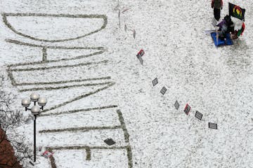 “Daunte” is written in the snow outside the Hennepin County Government Center during the jury deliberations in the trial of ex-Brooklyn Center Pol