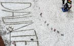 “Daunte” is written in the snow outside the Hennepin County Government Center during the jury deliberations in the trial of ex-Brooklyn Center Pol