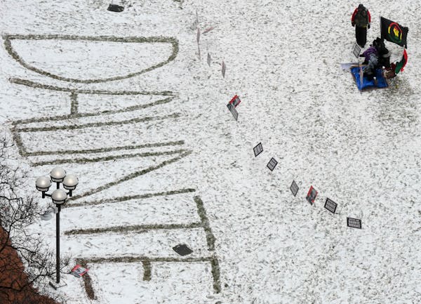 “Daunte” is written in the snow outside the Hennepin County Government Center during the jury deliberations in the trial of ex-Brooklyn Center Pol