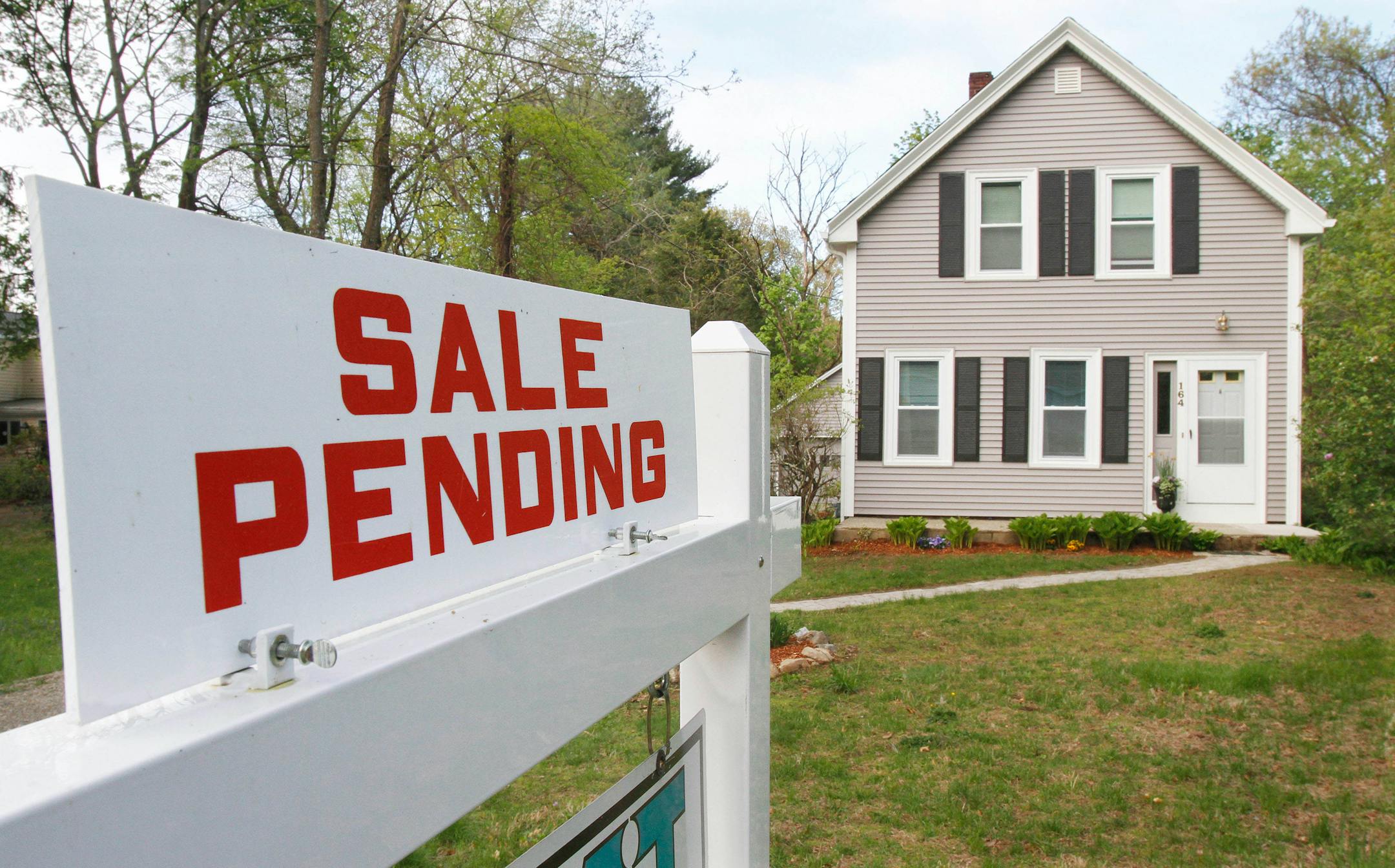 Twin Cities home sales were affected by the ultra-cold winter. File photo of real estate sign in an obviously warmer time of the year.