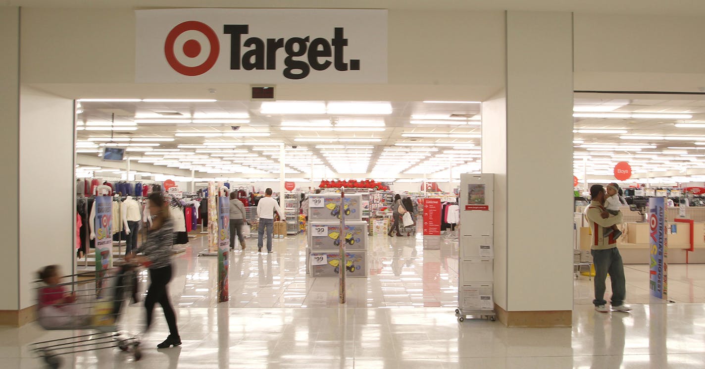 Shoppers walk in front of a Target Corp. store in Perth, Australia, on Monday, July 26, 2010. Wesfarmers Ltd., Australia's second-largest retailer, said sales at its Coles unit rose in the fourth quarter as the division's convenience stores and revamped fresh food areas in supermarkets drew more customers. Photographer: Tony Ashby/Bloomberg ORG XMIT: 102967514