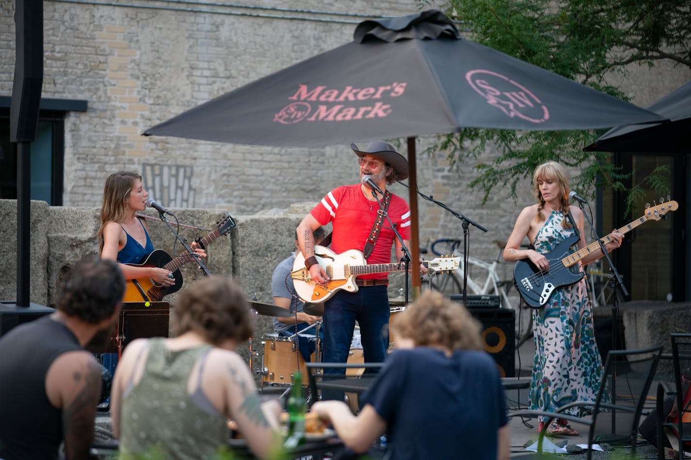 Savannah Smith, Adam Levy, and Barb Brynstad, from left, of Turn Turn Turn, performing on the patio at Icehouse Mpls Sunday evening. ] JEFF WHEELER • Jeff.Wheeler@startribune.com