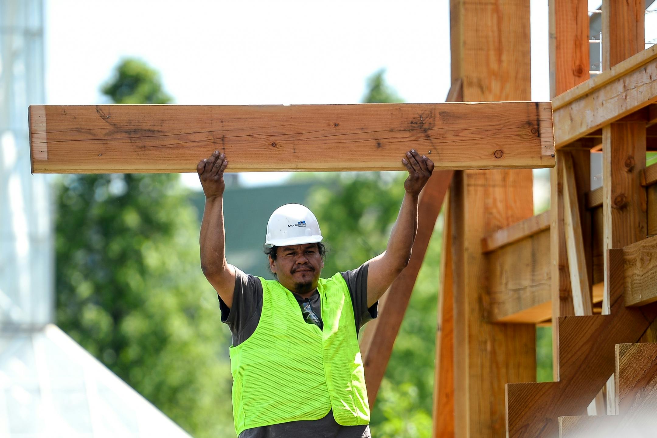 Brian LaBatte, a Lakota and Dakota from Cheyenne River, held up one of the pieces removed from the "Scaffold" Sculpture as its demolishment begun Friday. Staight Line construction