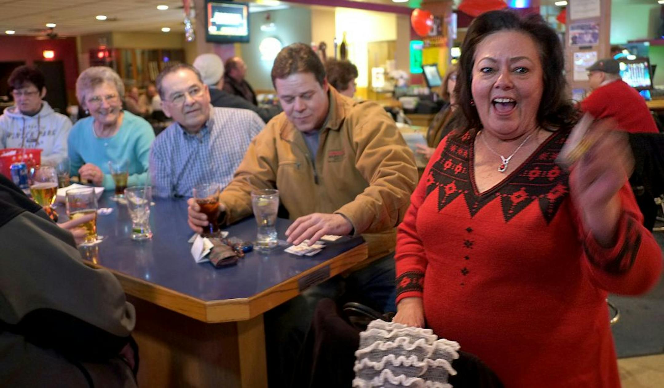Helen Branby celebrated after opening a winning pulltab athe Crystal VFW. "Everyone has their own system for playing,''Branby said.