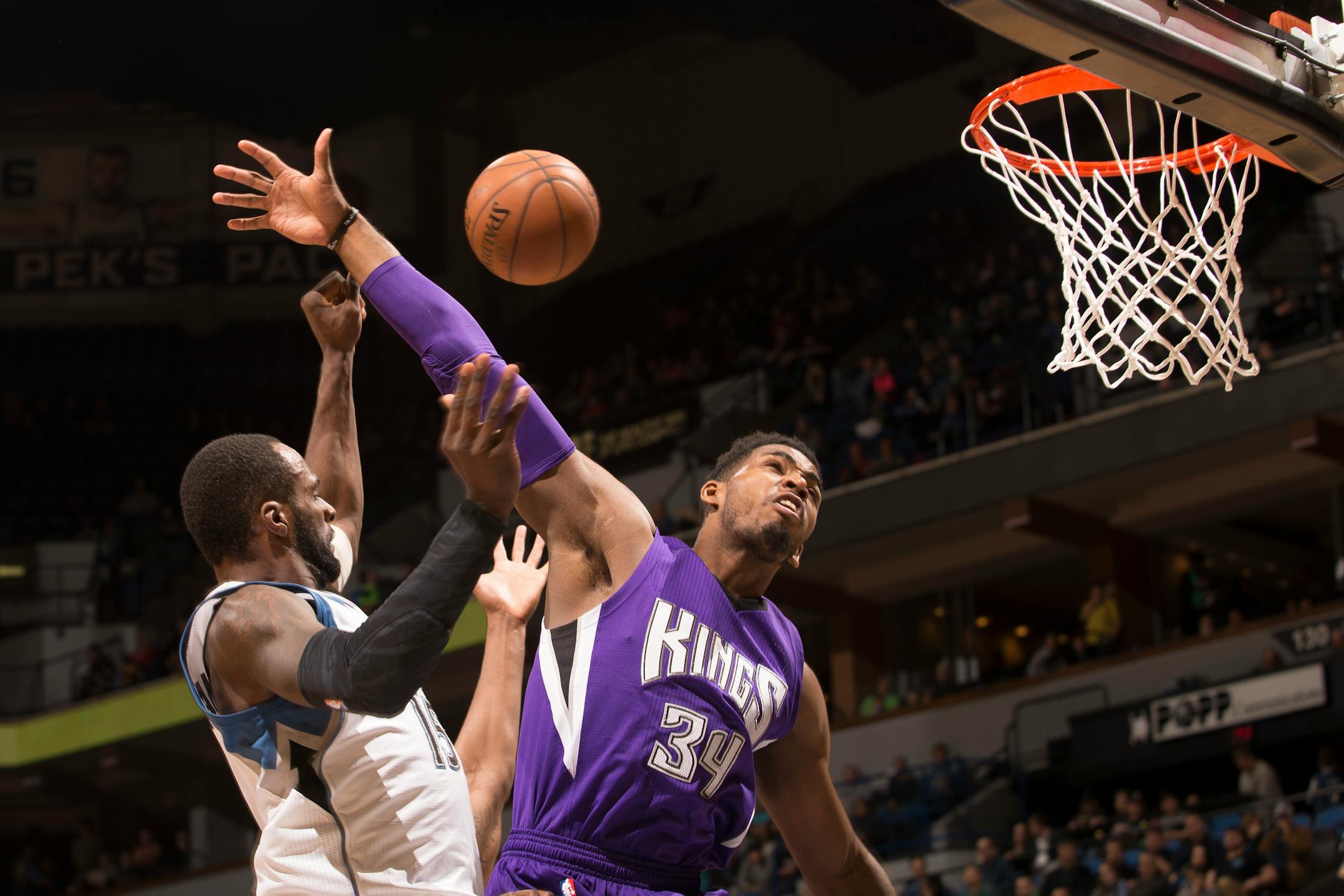 Sacramento Kings forward Jason Thompson (34) blocks a shot by Minnesota Timberwolves forward Shabazz Muhammad (15) during the first half of Thursday night's game.