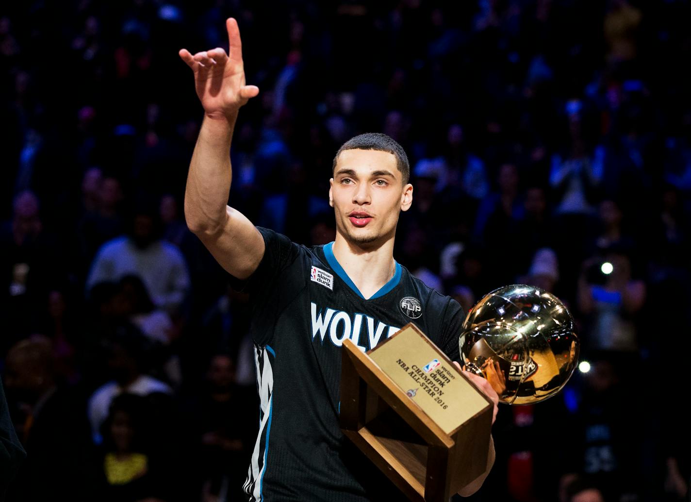 Minnesota Timberwolves' Zach LaVine holds the trophy after winning the slam dunk contest during the NBA All-Star weekend in Toronto, Saturday, Feb. 13, 2016. (Mark Blinch/The Canadian Press via AP)