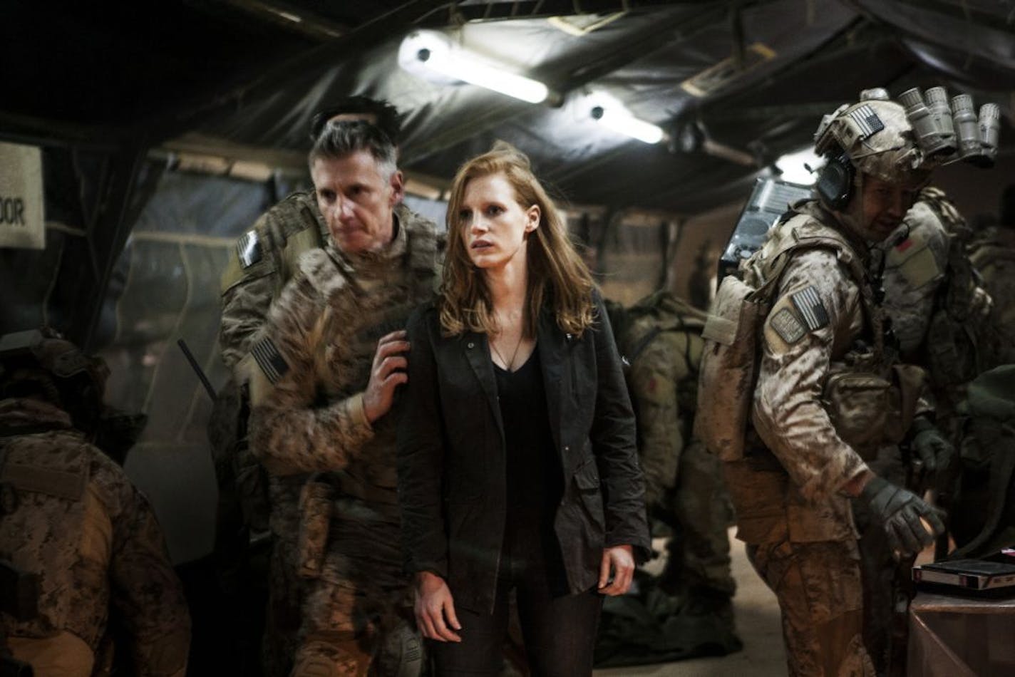 In this undated publicity photo released by Columbia Pictures Industries, Inc., Jessica Chastain, center, plays a member of the elite team of spies and military operatives, stationed in a covert base overseas, with Christopher Stanley, left, and Alex Corbet Burcher, right, who secretly devote themselves to finding Osama Bin Laden in Columbia Pictures' new thriller, "Zero Dark Thirty." Best-picture prospects for Oscar Nominations on Thursday, Jan. 10, 2013, include, �Lincoln,� directed by Steven