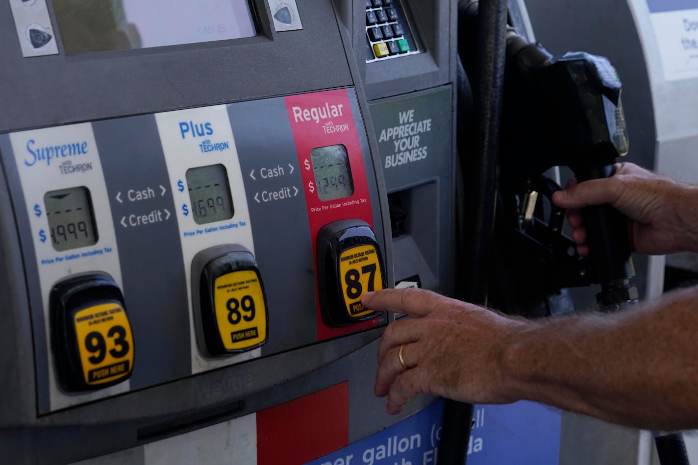 A customer pumps gas at an Exxon gas station, Tuesday, May 10, 2022, in Miami. Just as Americans gear up for summer road trips, the price of oil remains stubbornly high, pushing prices at the gas pump to painful heights. AAA said Tuesday, May 10, 2022, drivers are paying $4.37 for a gallon of regular gasoline. (AP Photo/Marta Lavandier)