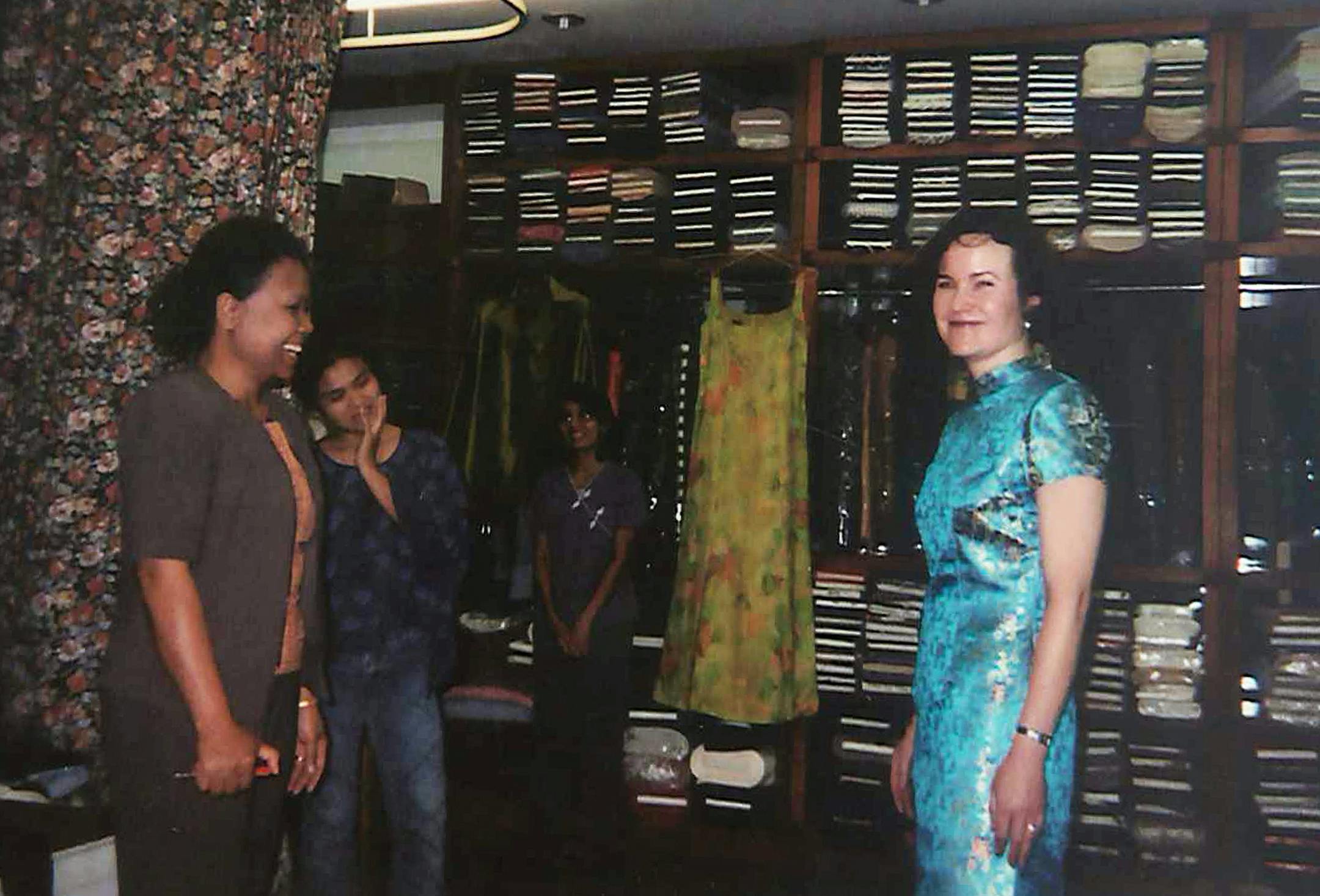 The author’s wife, Kathy, models her traditional silk dress prior to†final tailoring at Bangkok’s†Queen Thai Silk.
