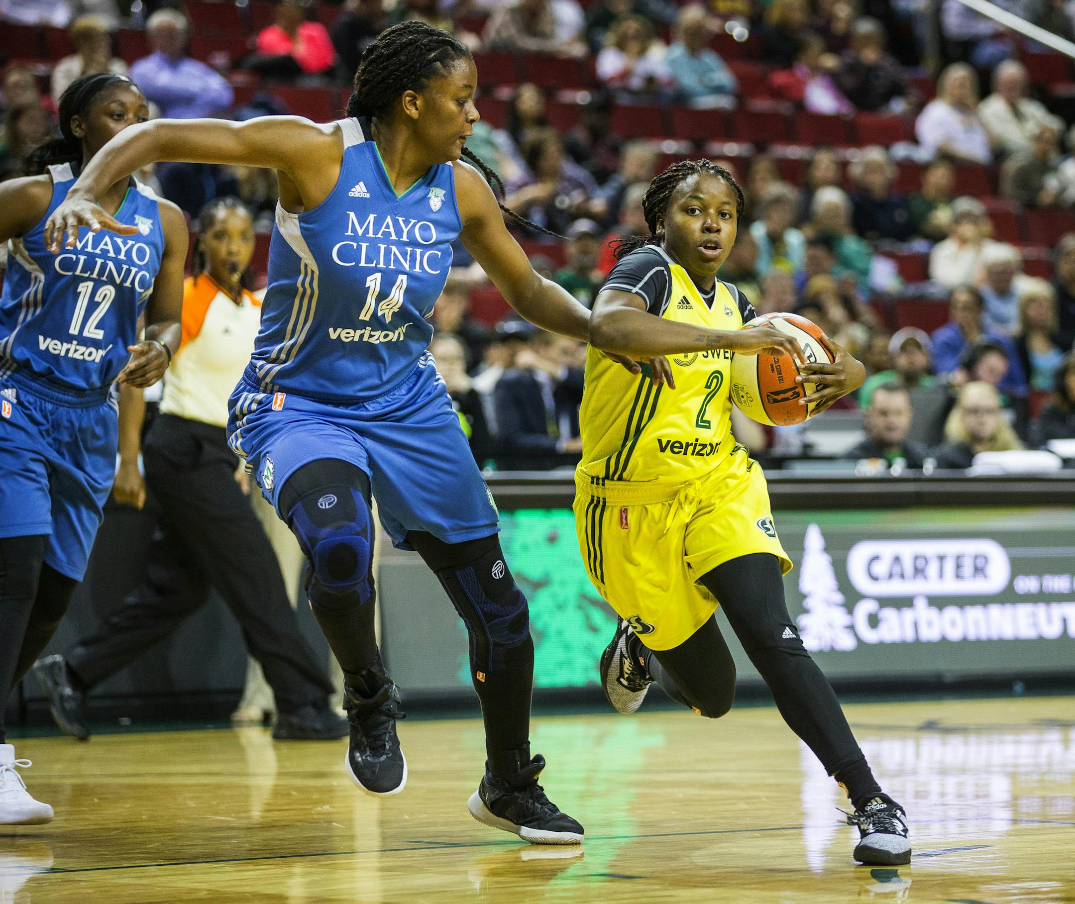 Seattle Storm guard Alexis Peterson can’t turn the corner on the lane against Minnesota Lynx center Temi Fagbenie during the fourth quarter of a WNBA basketball game \ (Dean Rutz/The Seattle Times via AP)