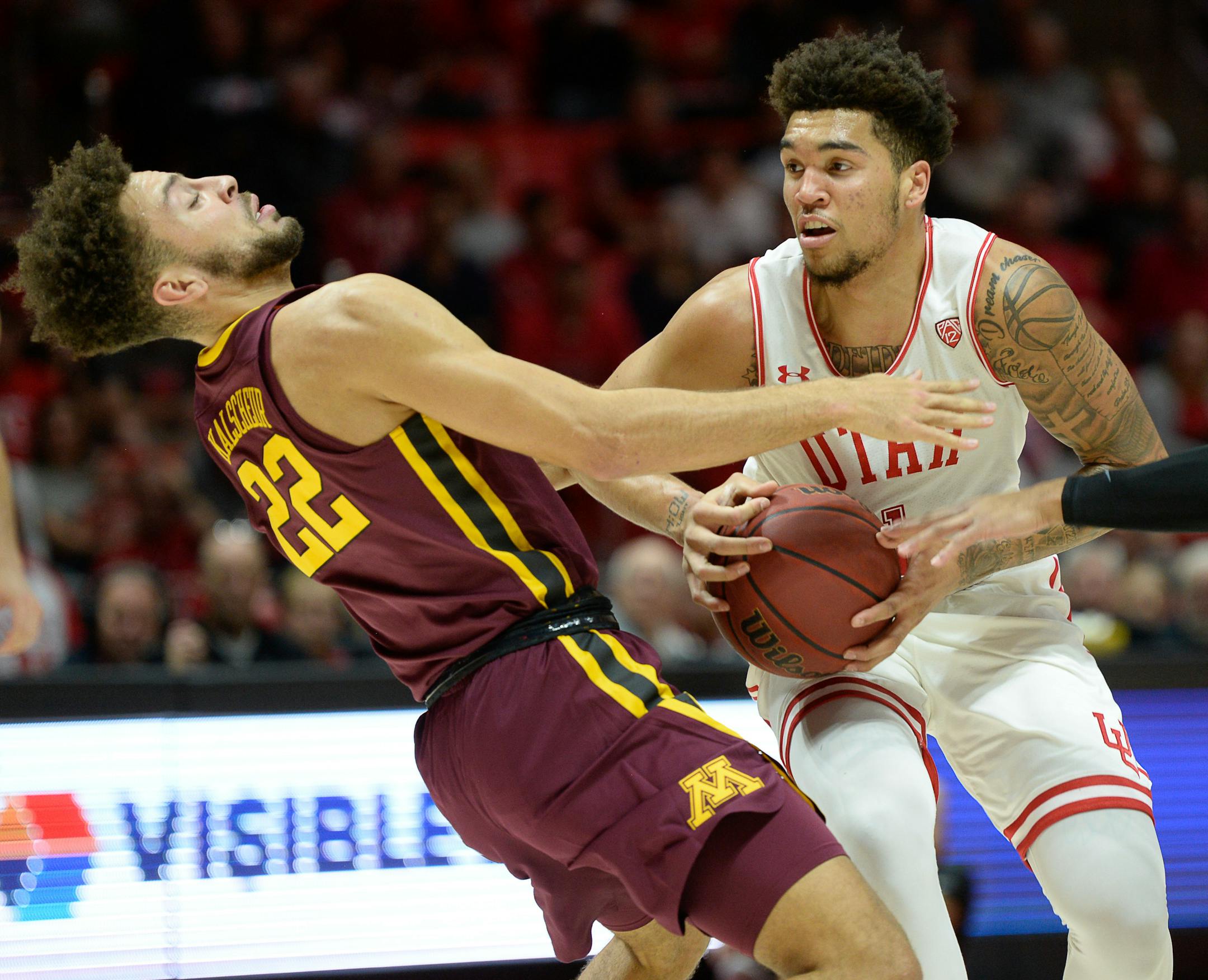 Minnesota guard Gabe Kalscheur gets knocked over by Utah forward Timmy Allen during Friday's first half.