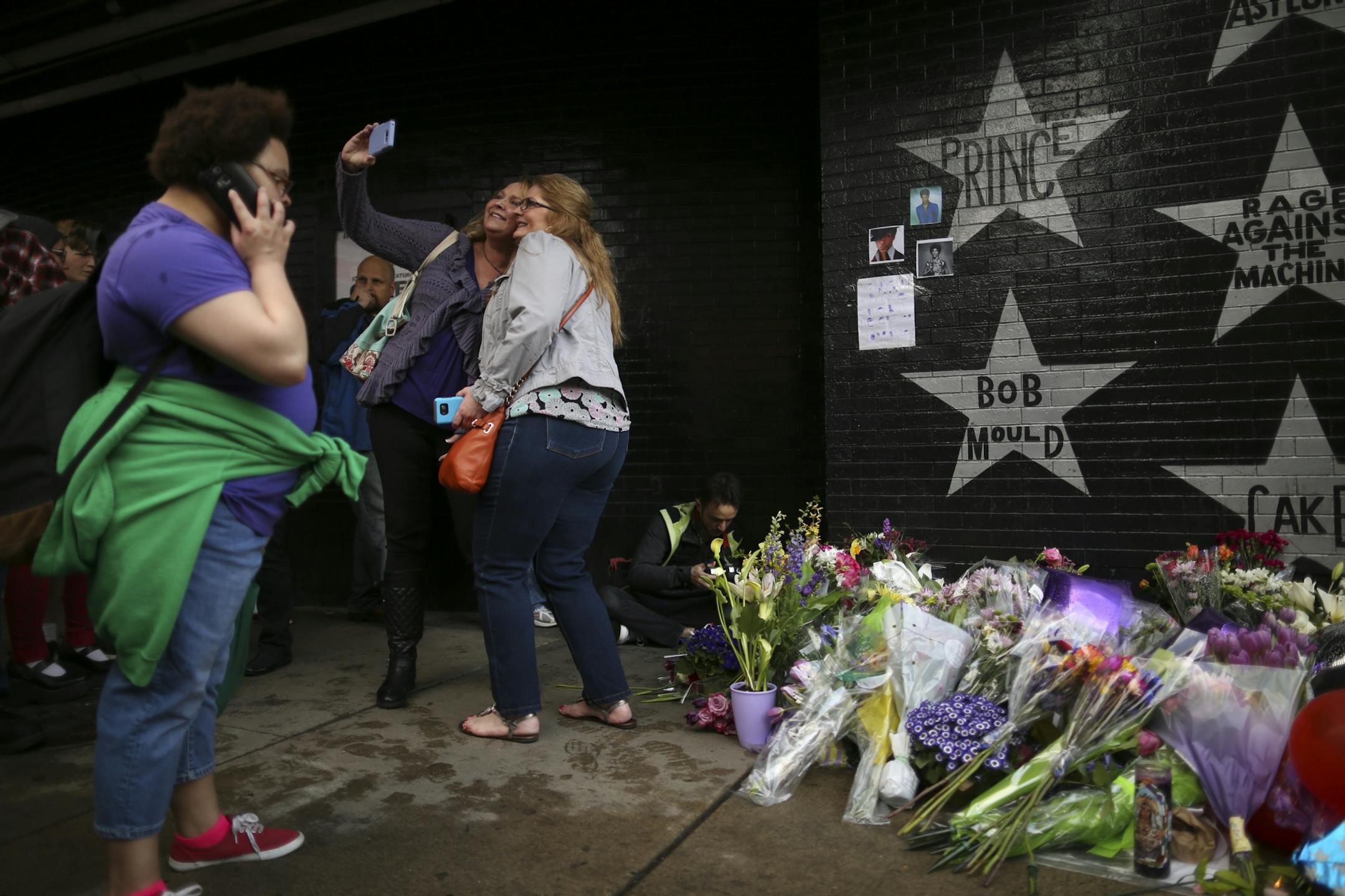 The growing memorial under Prince's star at First Ave. drew multitudes of fans throughout Tuesday afternoon and evening.
