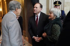 Supreme Court Justice Samuel Alito, center, and his wife Martha-Ann Alito, right, speaking with former Sen. Trent Lott, R-Miss., left, in 2018.