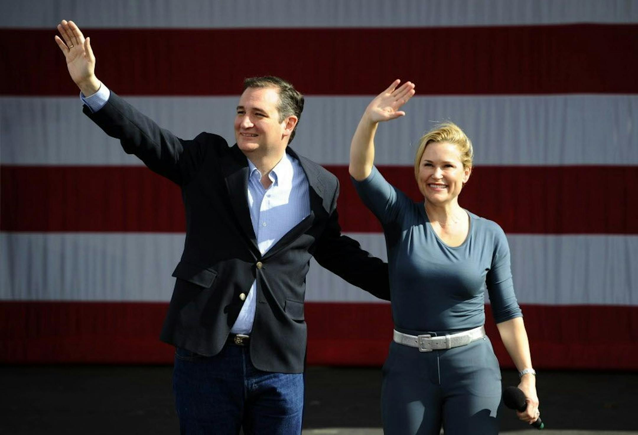 Republican presidential candidate Ted Cruz and wife Heidi wave to supporters during his Keep The Promise rally at the zMax Dragway in Concord, N.C., on Sunday, March 13, 2016.