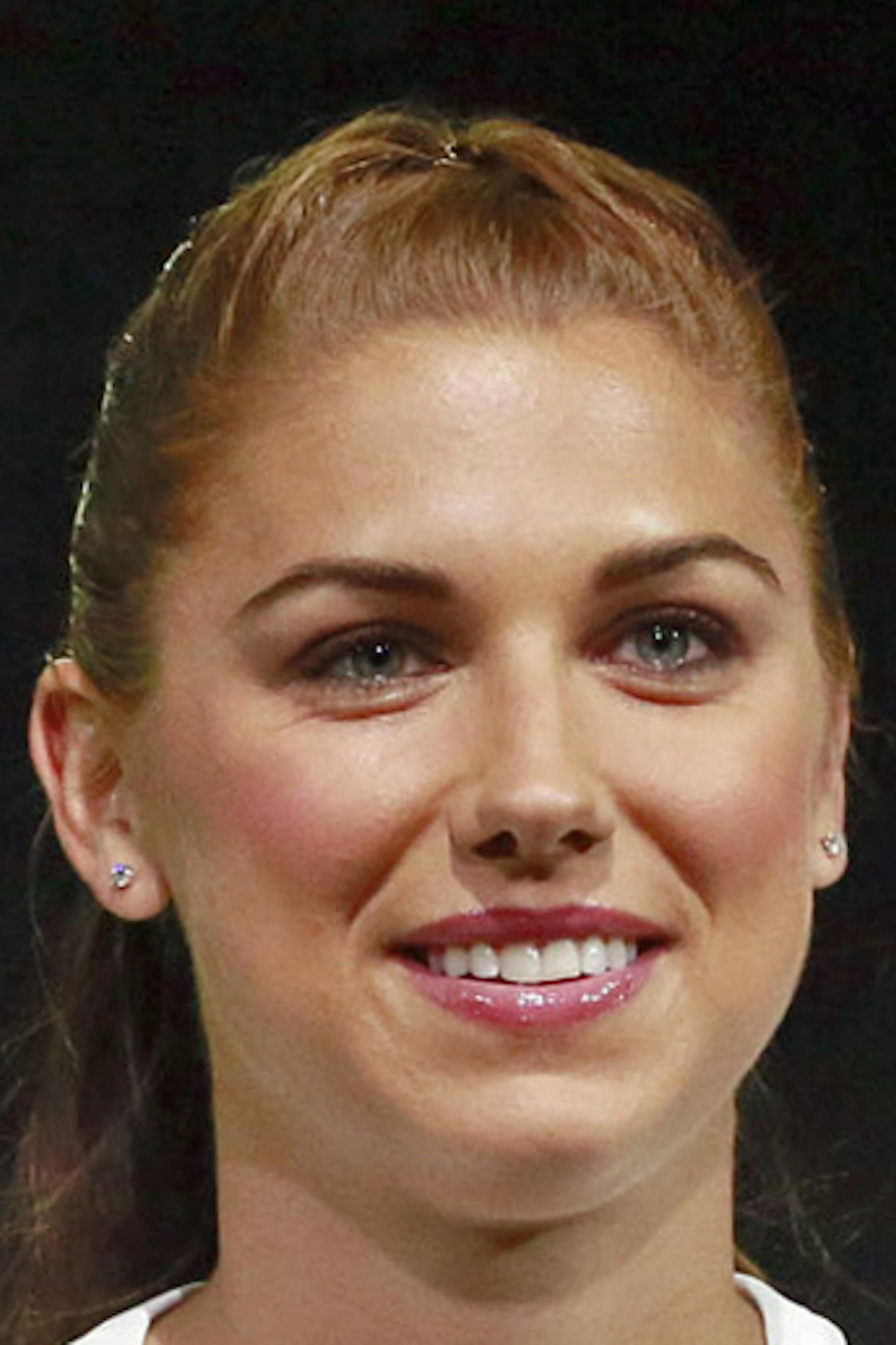 FILE - In this April 22, 2015, file photo, United States forward Alex Morgan poses in the new black and white home uniform for the U.S. women's World Cup soccer team during a news conference in Los Angeles. Morgan&#xed;s star rose quickly following her performance in Germany four years ago, when - as the youngest player on the U.S. World Cup team - she became a super sub with a goal and an assist in the final match against Japan. Now she&#xed;s a savvy veteran, handling her fame with aplomb as s