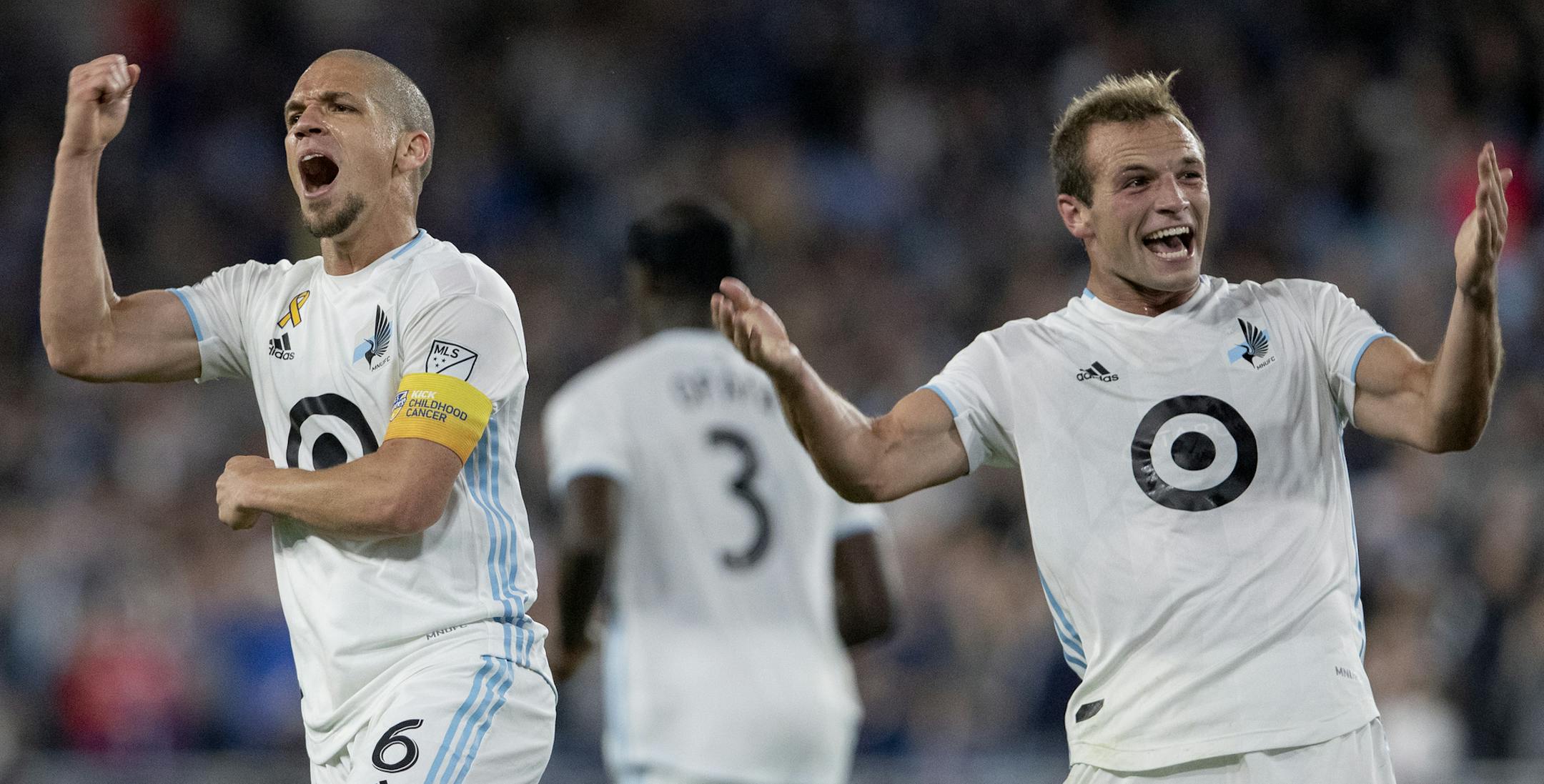 Minnesota United's Osvaldo Alonso (left) celebrates with teammate Chase Gasper (right) after Alonso scored a goal against Sporting Kansas City during an MLS match in September.