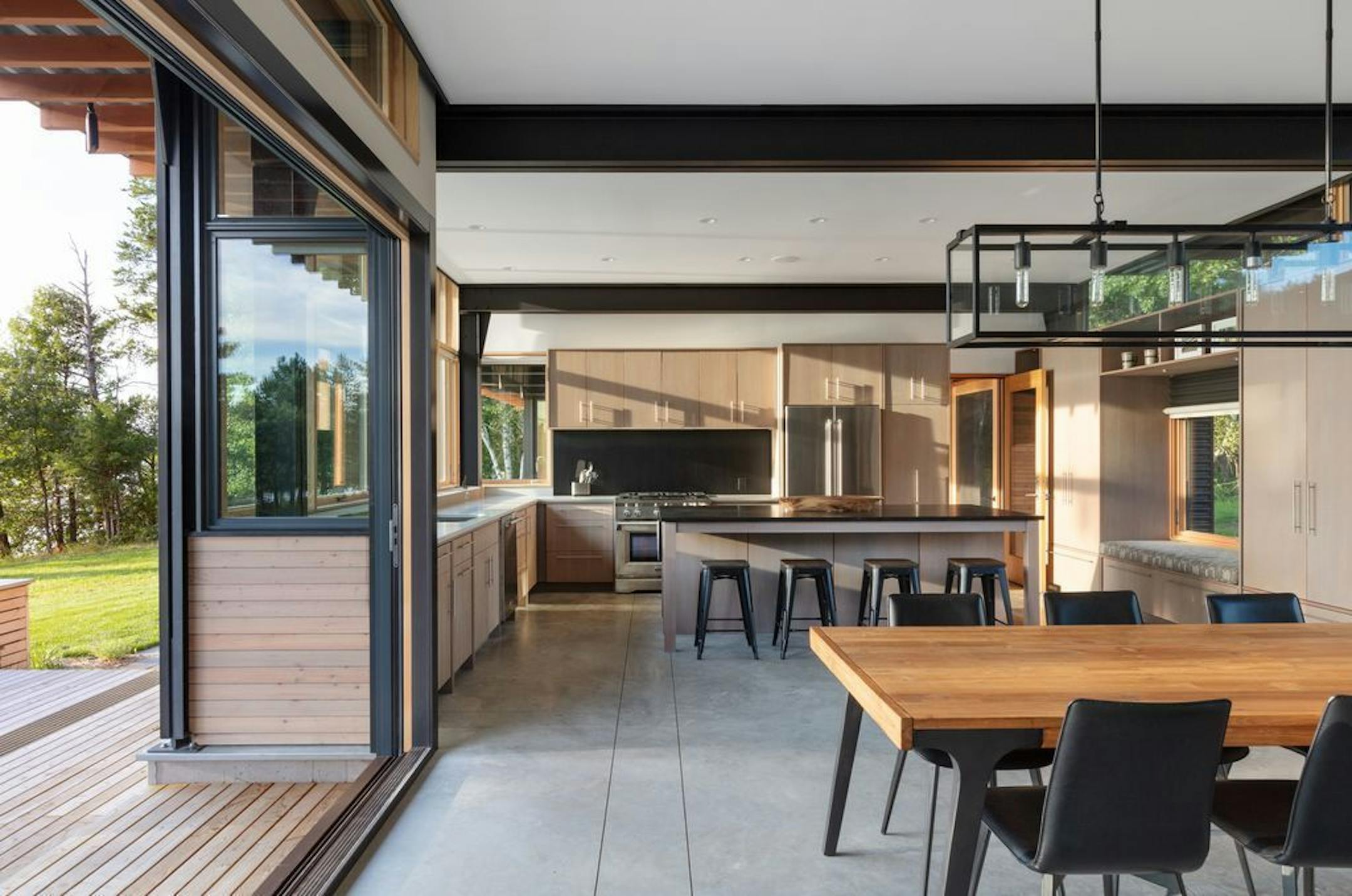 Bifold doors create indoor-outdoor flow in a Northern Wisconsin lakeside retreat, designed by David O'Brien Wagner, one of the Twin Cities architects on the panel for the "Your Ideal Home" event April 25.