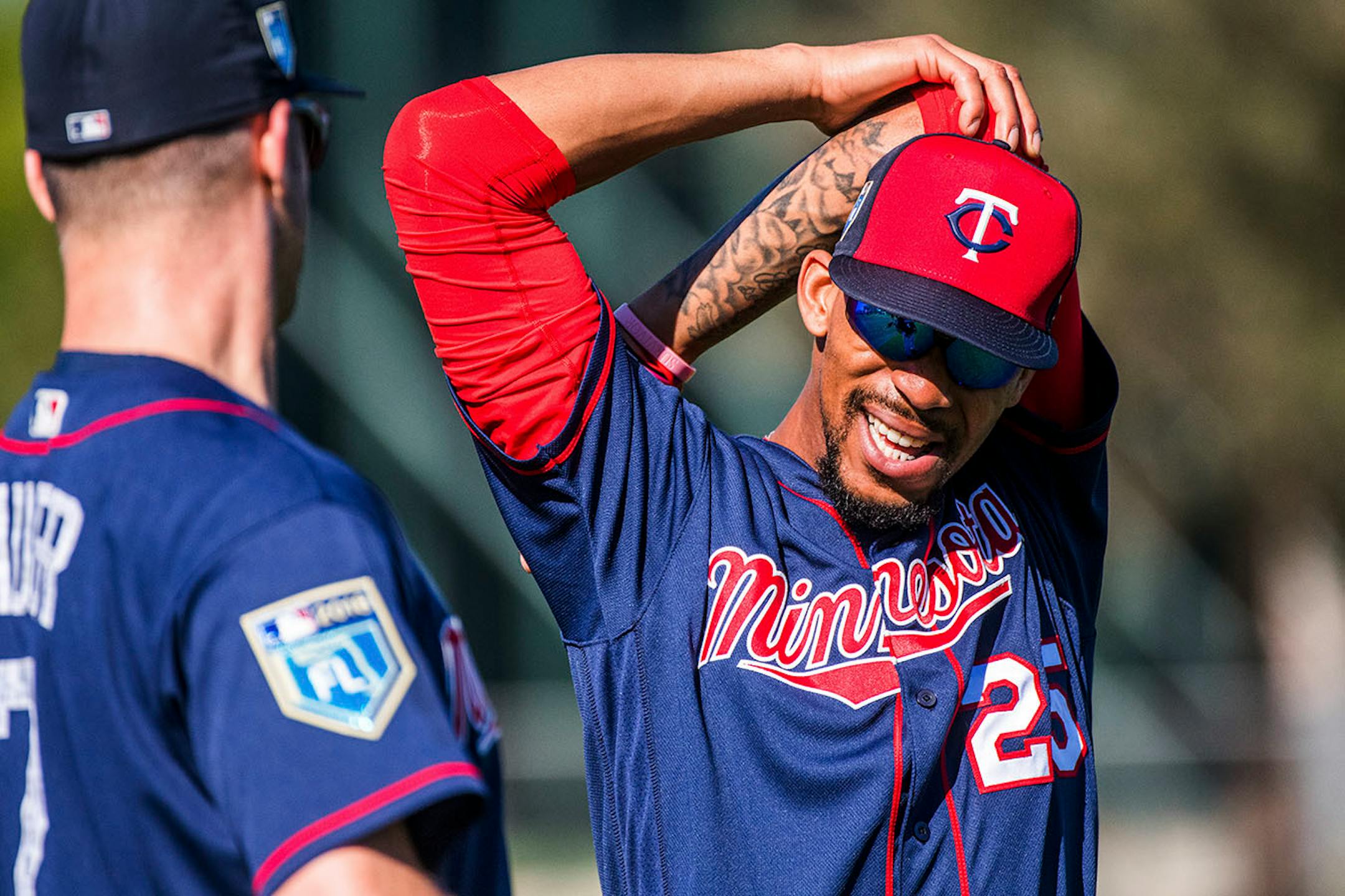 Twins outfielder Byron Buxton (25) joked with Twins first baseman Joe Mauer (7) during warmups.