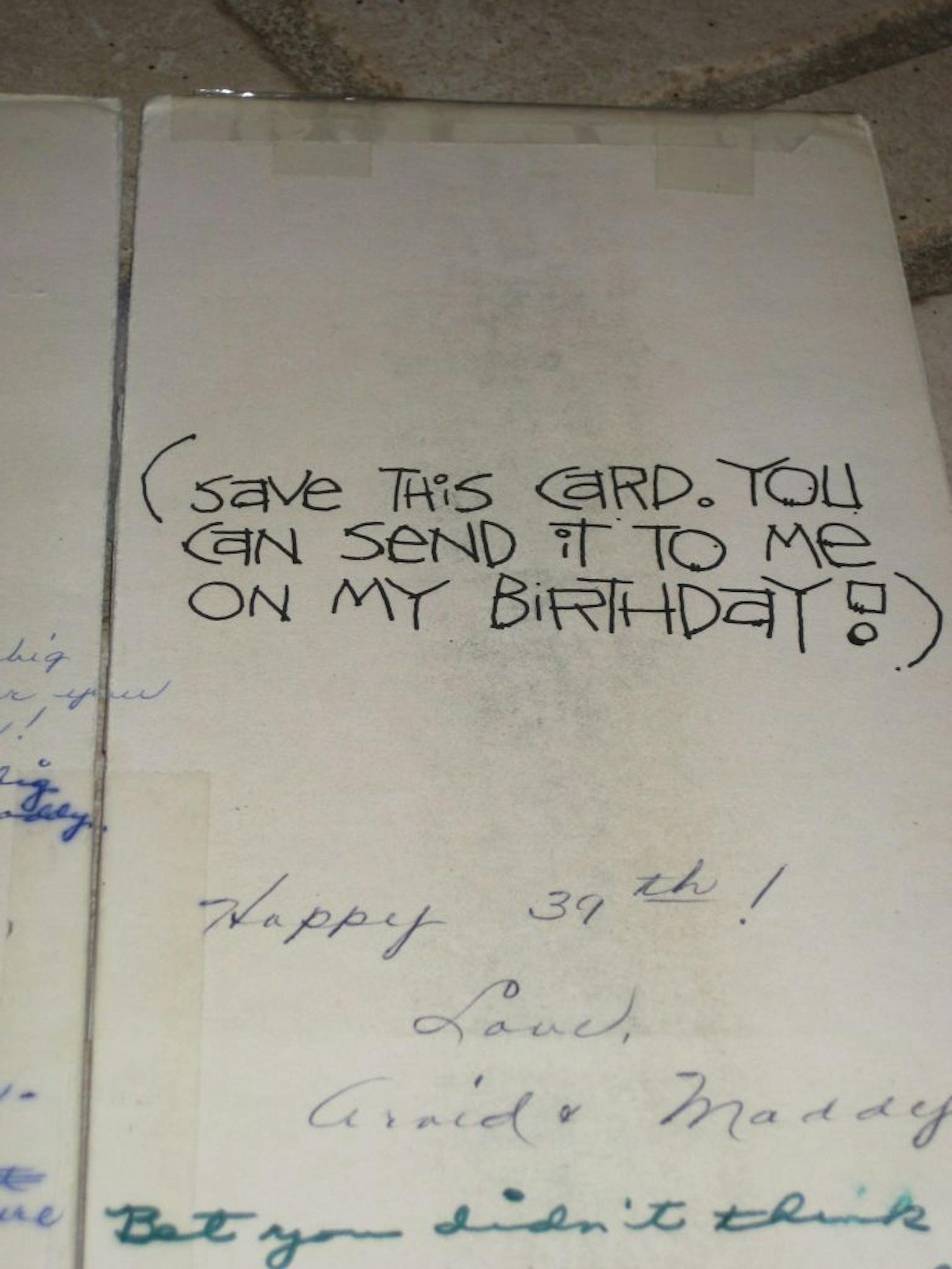 PHOTO BY GAIL ROSENBLUM. Tom Hamilton of Mora, Minnesota, (with wife, Gwen), turns 80 on Tuesday, June 7. He holds the birthday card that he and his sister-in-law, Madolyn Mann, 79, of Pharr, Texas, have exchanged annually since 1975.