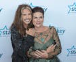 Steven Tyler and Tani Austin on the red carpet at the Starkey Hearing Foundation "So The World May Hear" Gala.