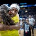 Lynx center Sylvia Fowles (34) hugs Seattle's guard Sue Bird (10) after the Lynx lost to the Seattle Storm 96-69.