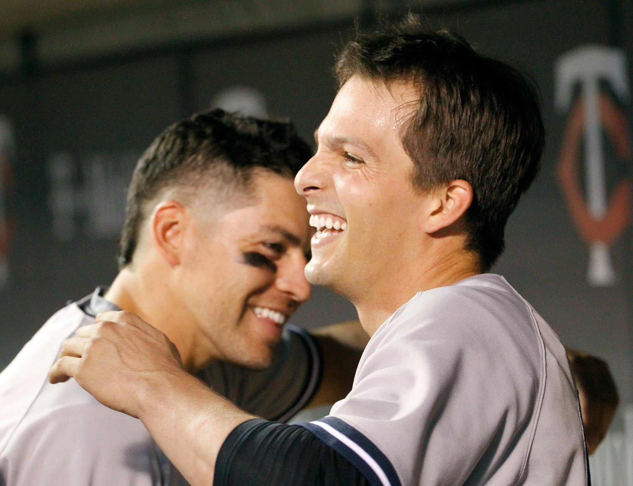 The Yankees' John Ryan Murphy, right, and Jacoby Ellsbury celebrate after Murphy's three-run homer off Twins closer Glen Perkins on Saturday night. A day later, New York was celebrating a series victory.