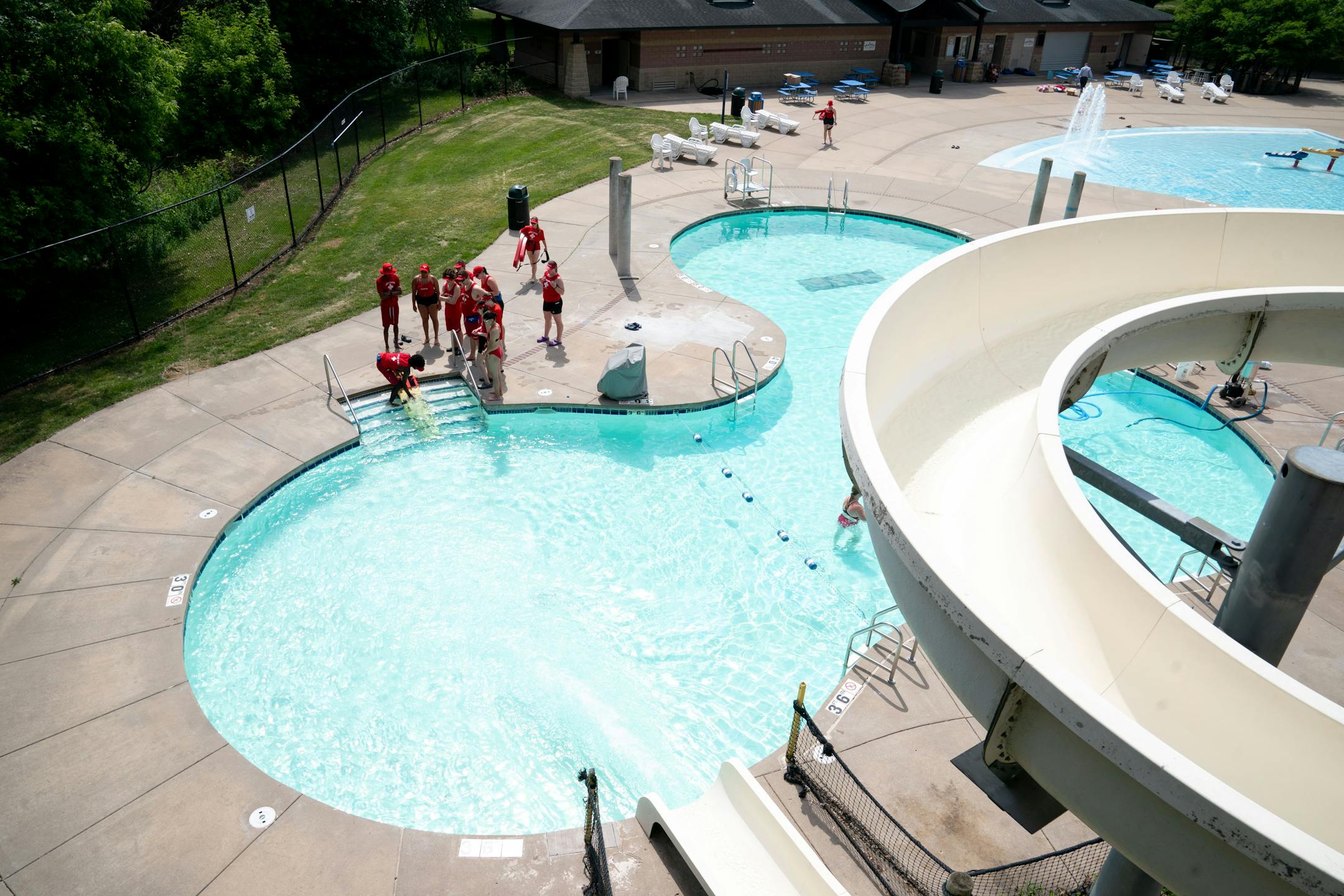 Lifeguards-in-training participate in a rescue exercise during a training program for new Ramsey County lifeguards.